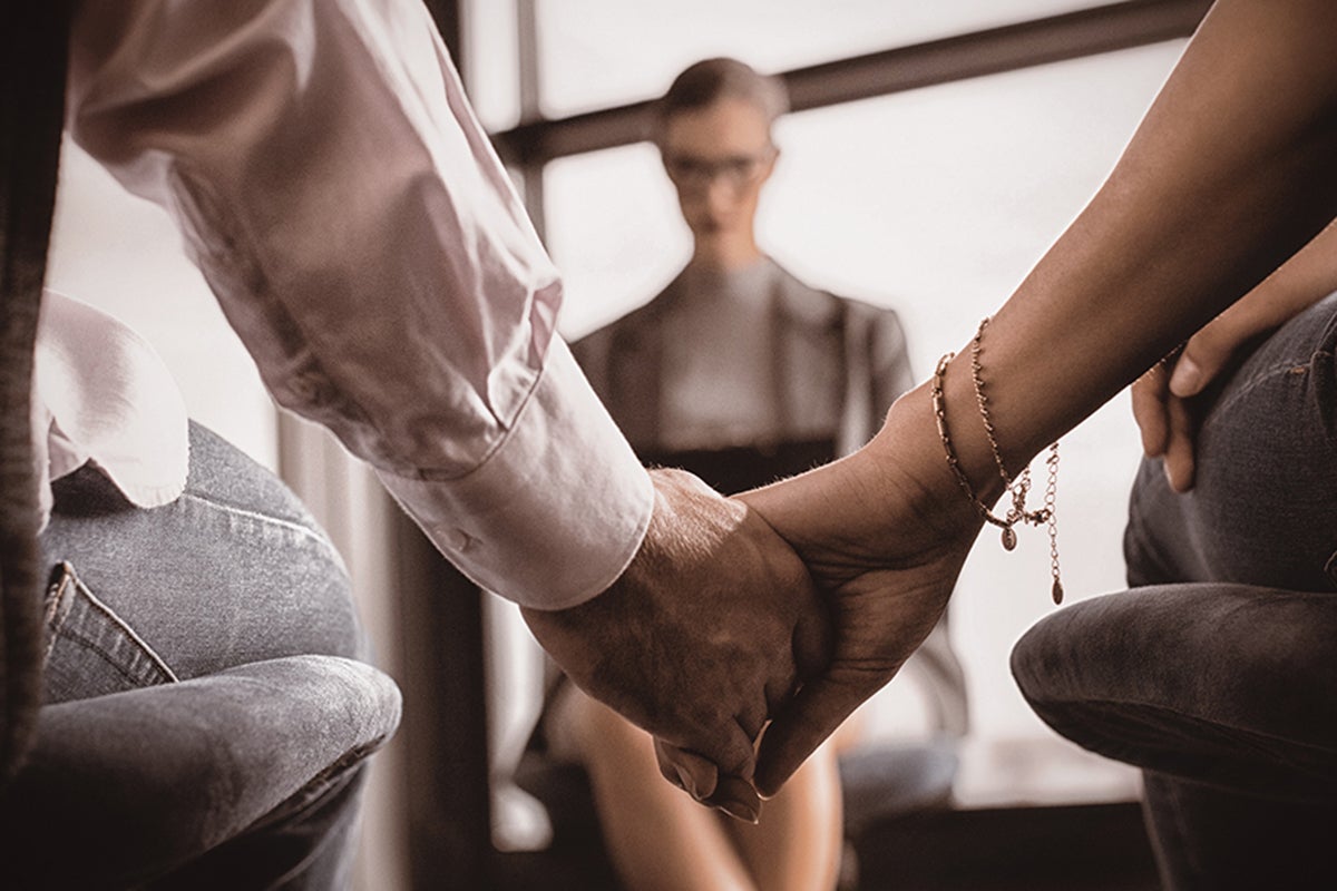 A couple is holding hands