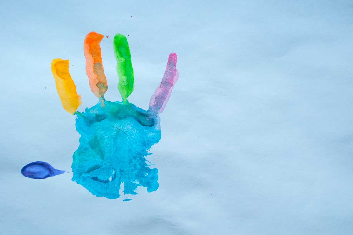 painted hand on a piece of paper