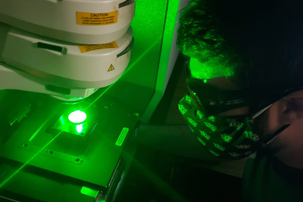 man doing laser research