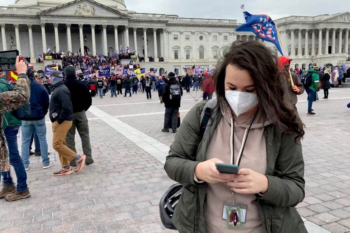 USA Today reporter Christal Hayes covers the events at the U.S. Capitol on Jan. 6.