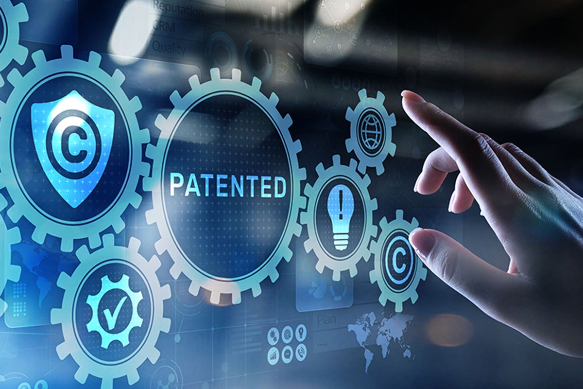 photo illustration of patent process with finger about to make a selection