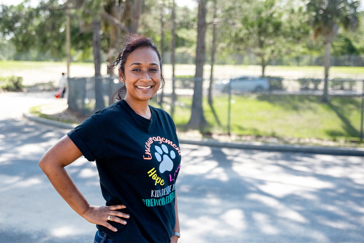 Nisha Phillip Malahoo profile shot, smiling and looking at the camera