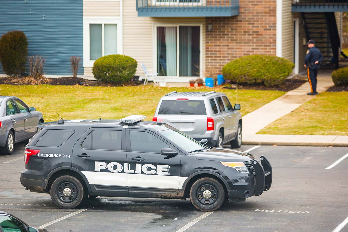 Police vehicle outside of apartments