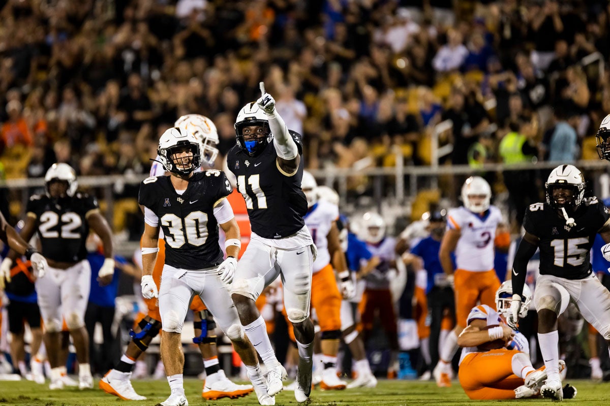 Jeremiah Jean-Baptiste points to crowd as he runs on the field