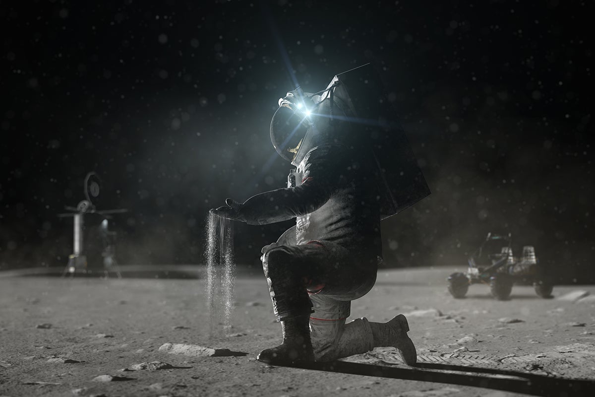 Conceptual image of an astronaut touching lunar dirt