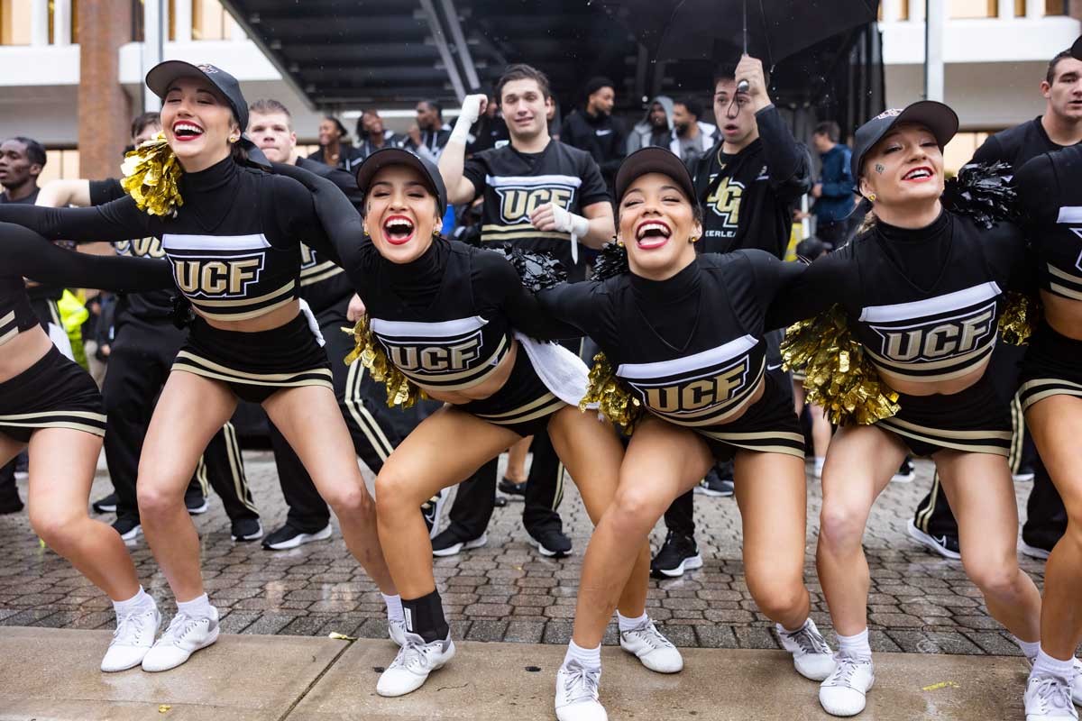 Cheer team locked arm in arm at Spirit Splash