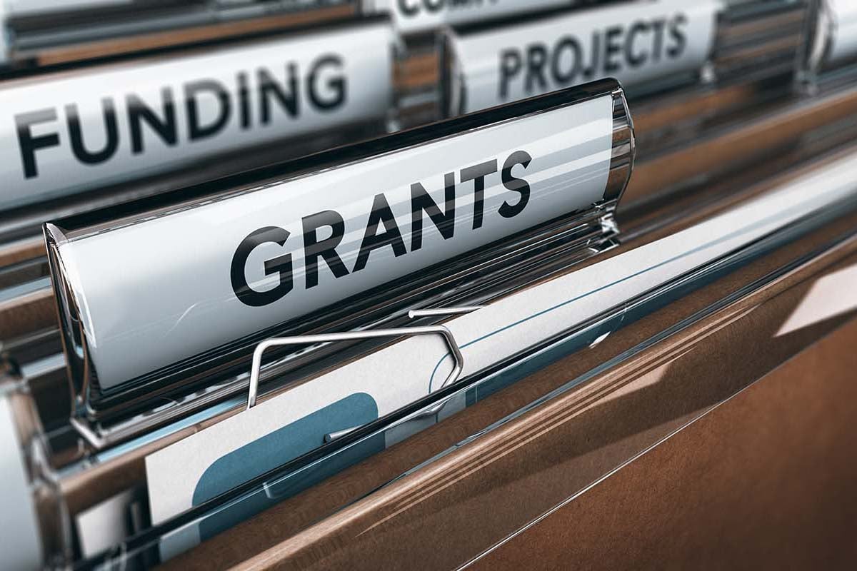 Image of a folder that says GRANTS on it
