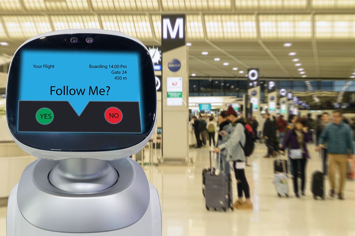 service robot is shown in a busy area with people in the background
