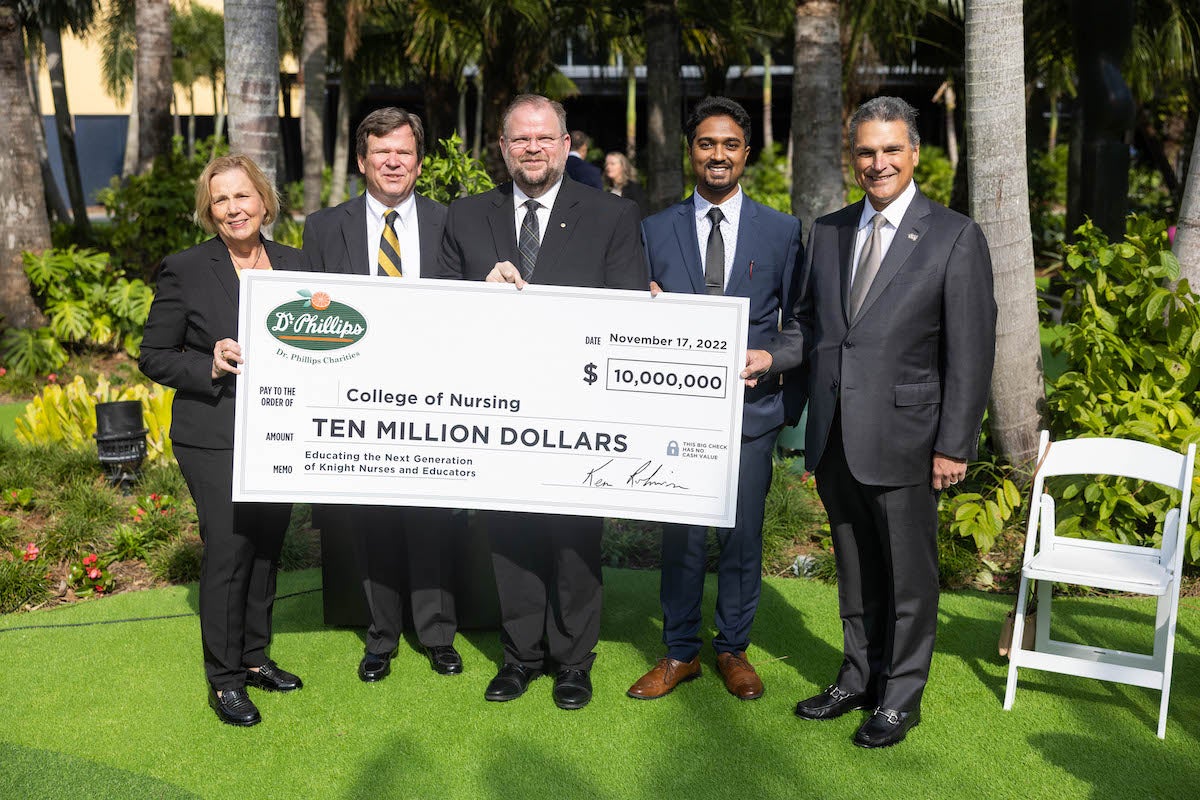 Left to right: UCF College of Nursing Dean Mary Lou Sole, President and CEO for Dr. Phillips, Inc. and The Dr. P. Phillips Foundation Kenneth D. Robinson, UCF President Alexander N. Cartwright, UCF Nursing alum Sayid Yasin '22, and UCF Board of Trustees Chair Alex Martins ’01MBA