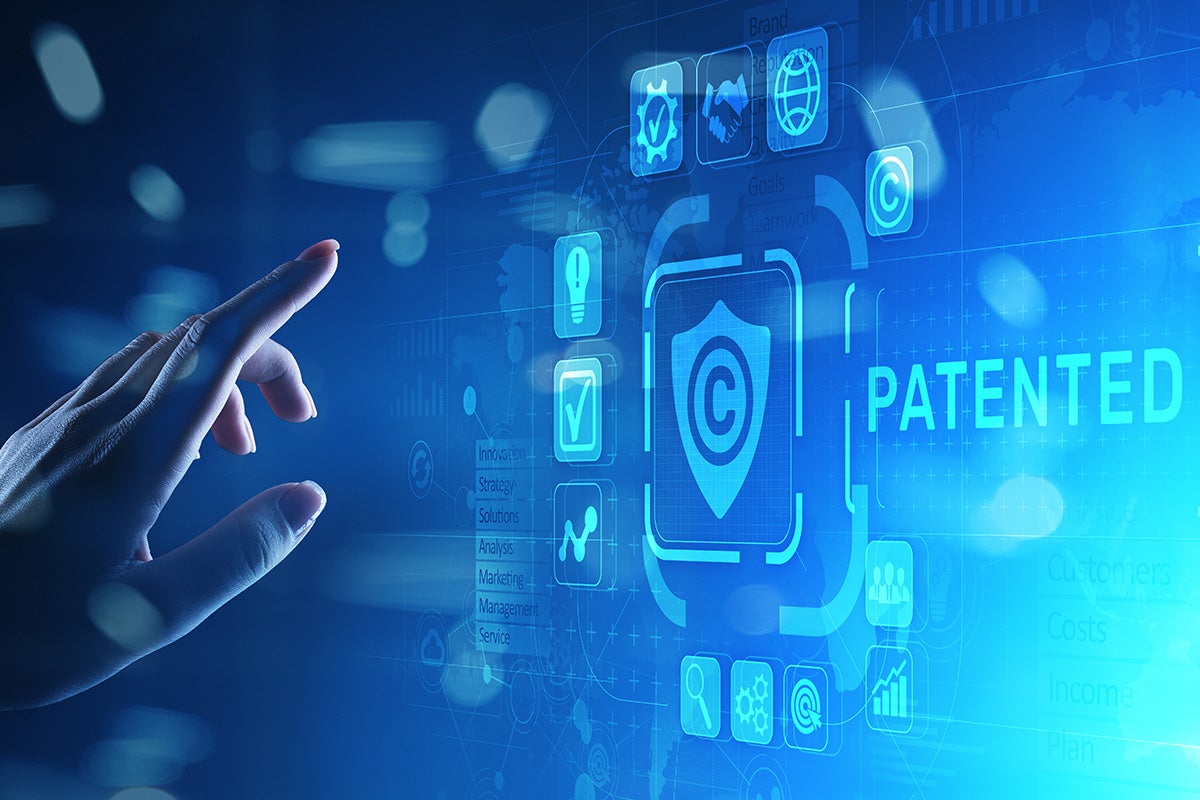 image of a hand selecting a patent button on a touch screen