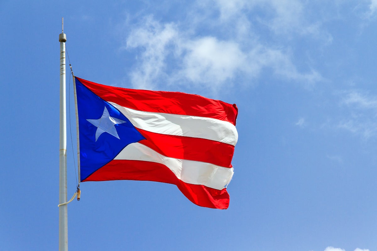 Puerto Rican flag against a blue sky