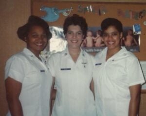 An old photo of three nurses in uniform 