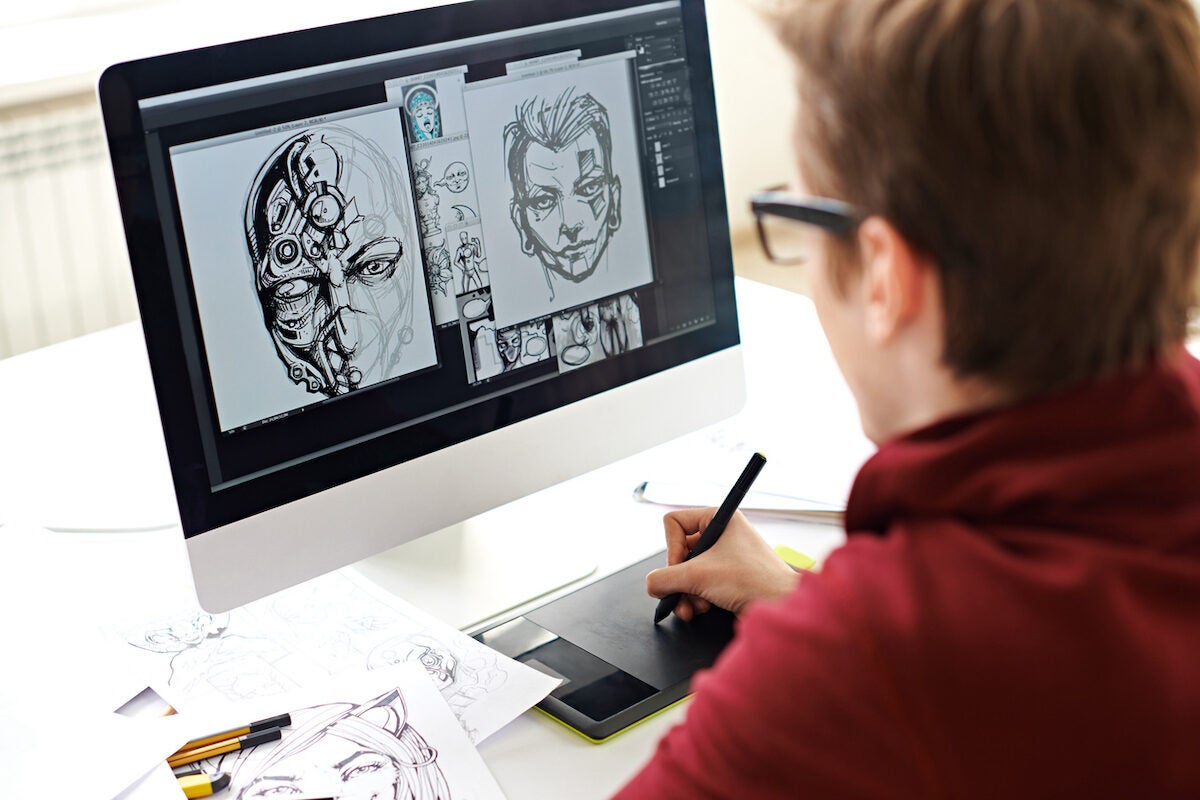 Skilled comic artist creating comic book on computer