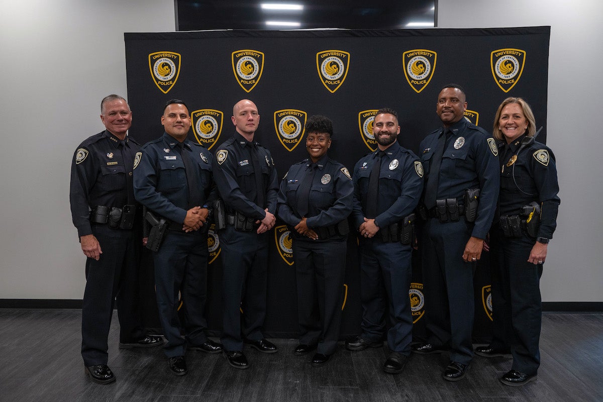 UCF Police officers in uniform posing for a photo