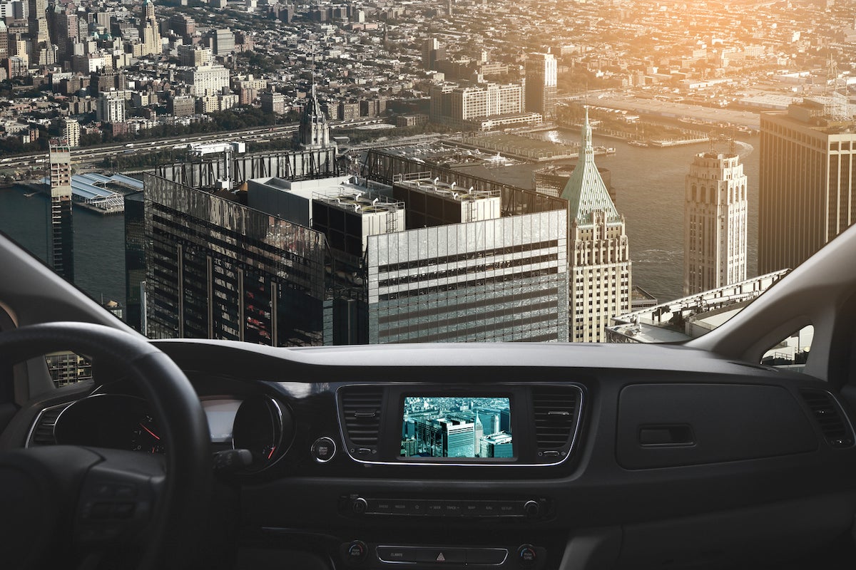 Artist rendering of the view inside a flying car over a city