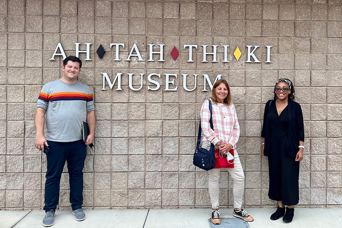 UCF Writing and Rhetoric postdoctoral scholar Jeremy Carnes, donor Monica King, and Writing and Rhetoric Associate Professor Jamila Kareem are shown during a visit to the Ah-Tah-Thi-Ki museum in Fall 2022.