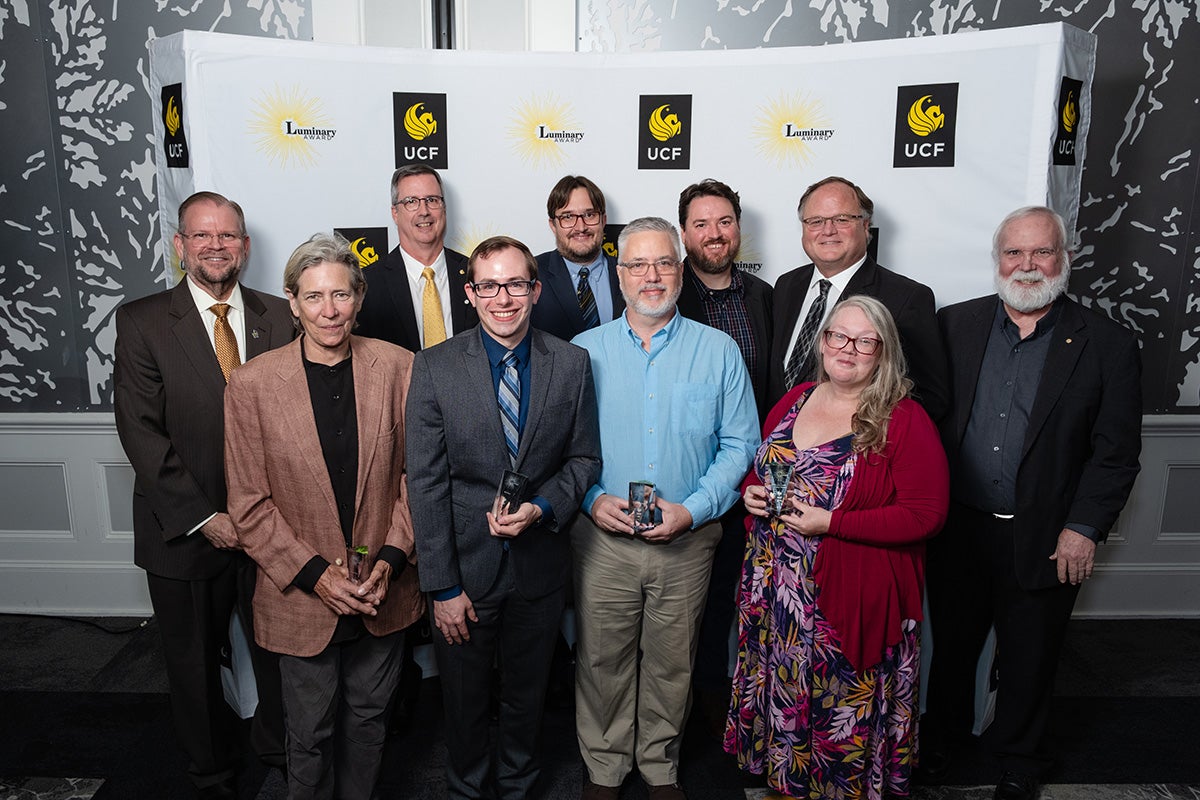 Back row: Paul Lartonoix is an assistant dean in UCF’s College of Arts and Humanities; Rudy McDaniel is the director of UCF’s School of Visual Arts and Design; Tim Brown is an assistant professor of scenery and projection design; and Jeffrey Moore is the dean of UCF’s College of Arts and Humanities.Front row: Vandy Wood is an associate professor of scenic and lighting design; Rob Siler is an assistant professor of lighting and projection design; Bert Scott is director of production for Theatre UCF and a professor of theatre; and Claudia Lynch is an assistant professor of stage management.