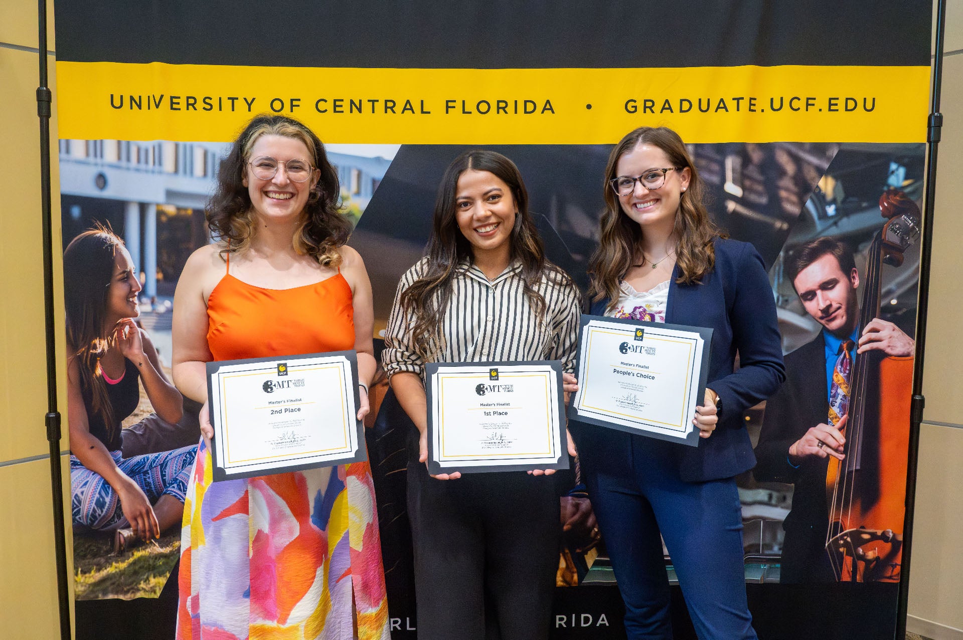 winners of master's 3mt (left to right) Cory Kennedy Barrow (2nd Place), Melanie Cedeno Lopez (First Place), and Meghan Kane (People's Choice)