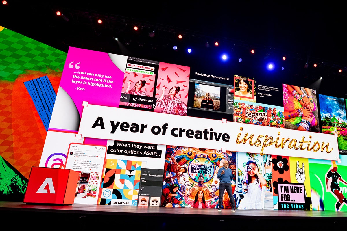 Speaker on stage at Adobe Max conference is shown