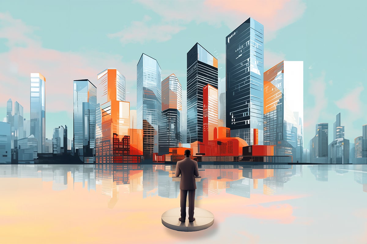 a man stans before a row of skyscraper buildings