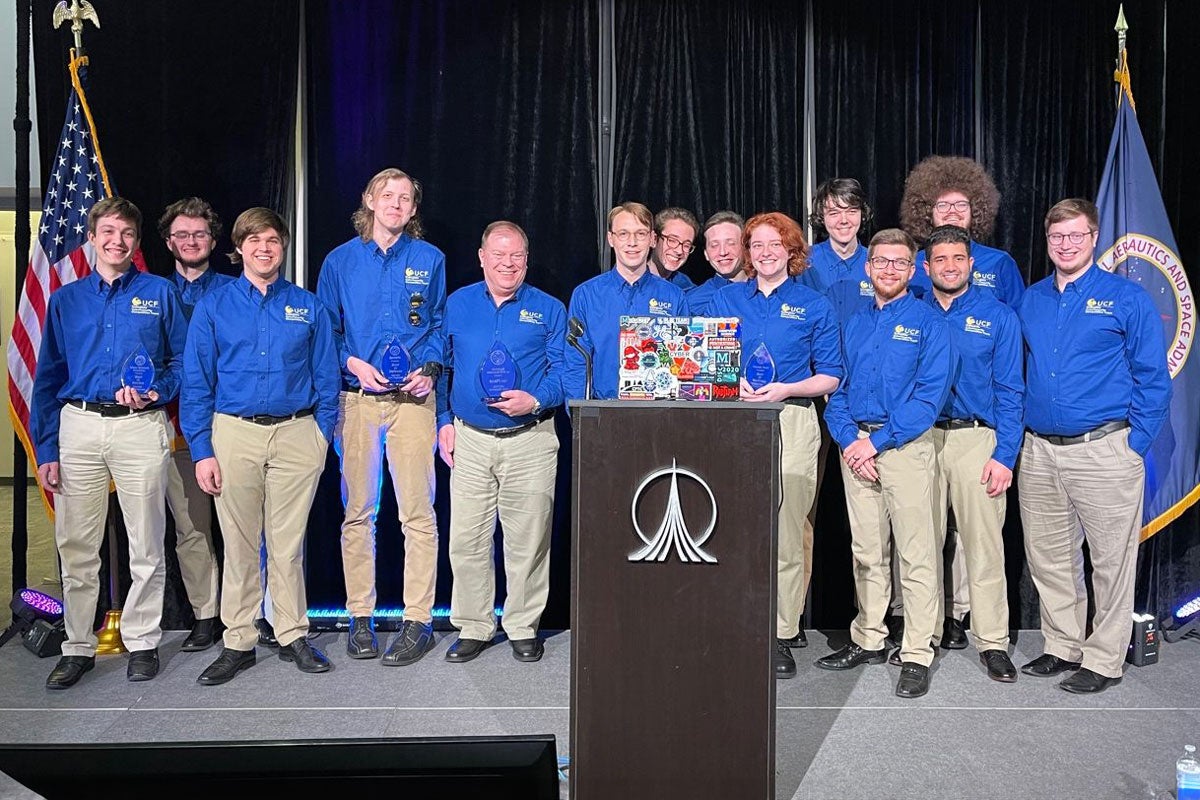 UCF Collegiate Cybersecurity Competition Team on stage