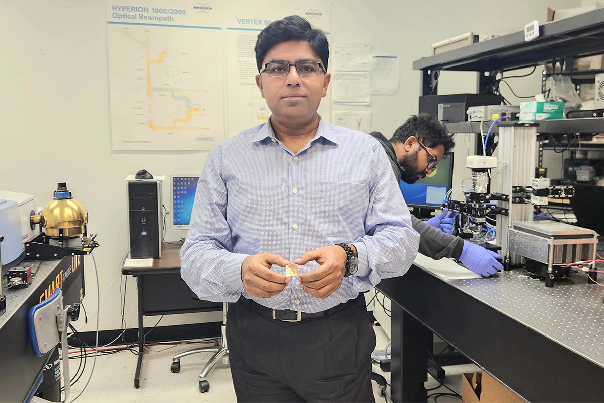 UCF NanoScience Technology Center professor Debashis Chanda shows the plasmonic platform he developed that significantly improves the detection of the chirality of molecules.