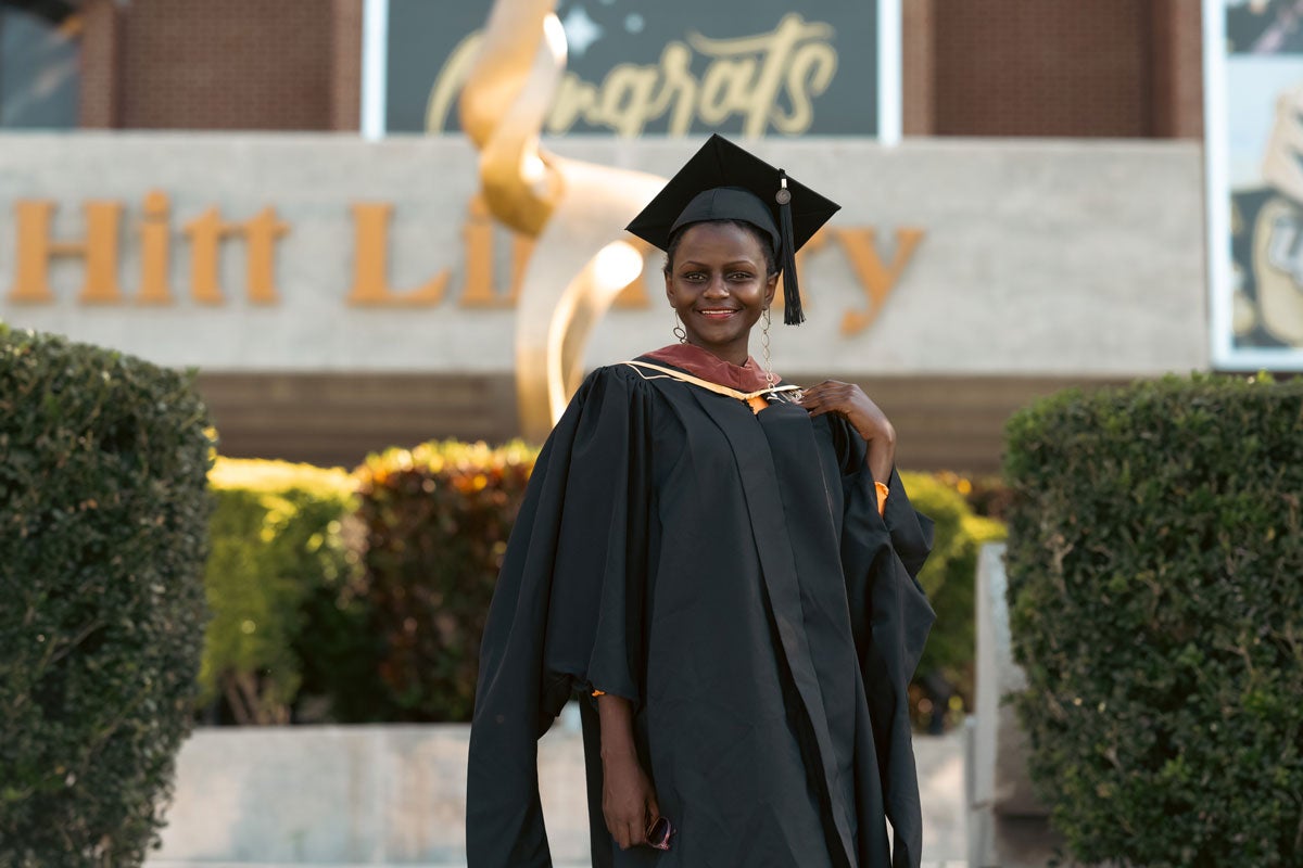 Njeri Kinuthia wearing a graduation cap and gown