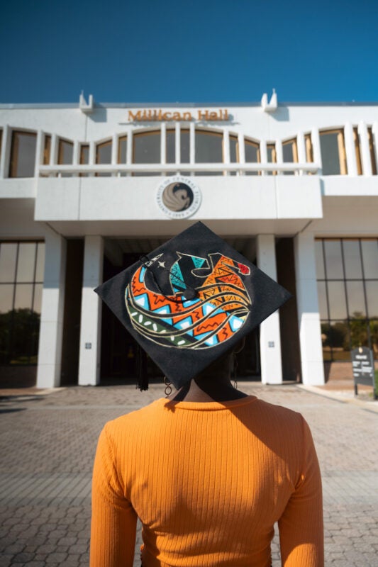 Njeri Kinuthia's grad cap features a Pegasus with an artistic design