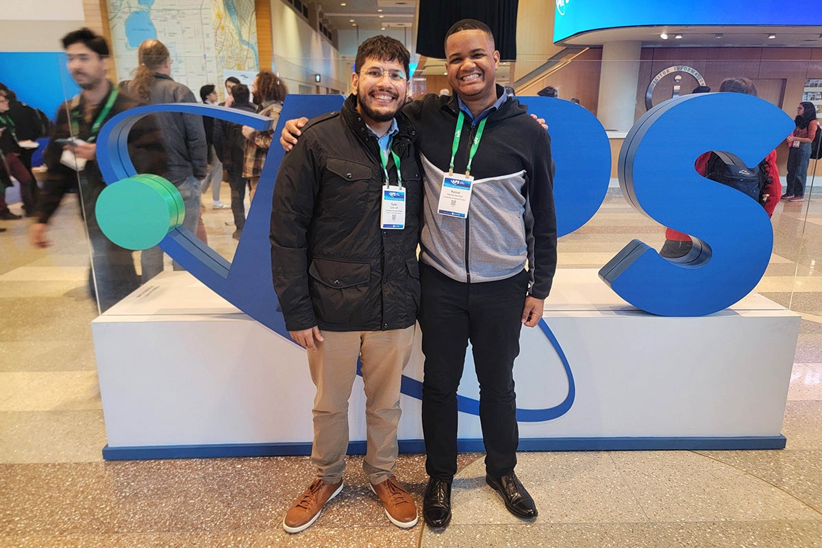 Study authors Dylan Jeff (left) and Kamal Harrison (right) are pictured at the American Physical Society's March meeting.