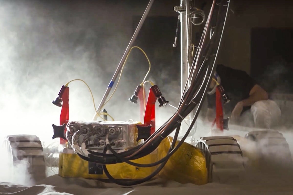 A rover being tested inside the UCF Exolith Lab's Regolith Bin.