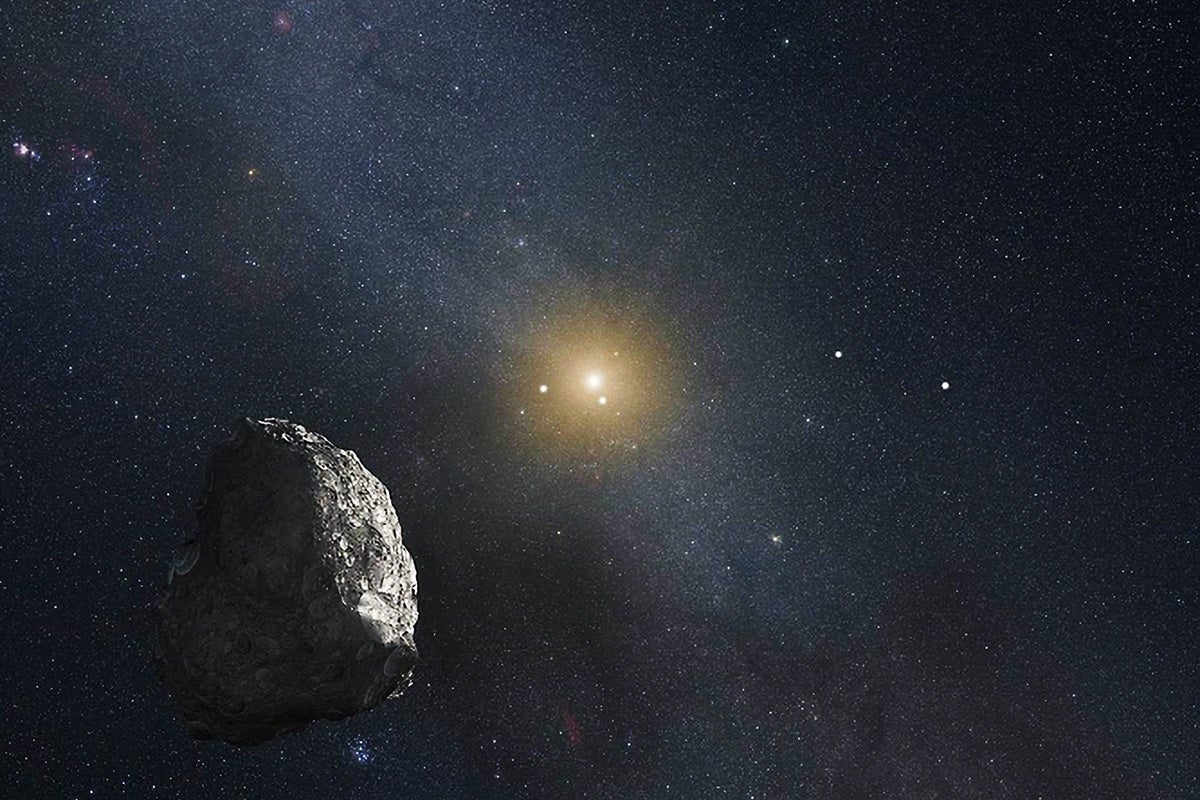 An artist’s impression of a Kuiper Belt object (KBO), located on the outer rim of our solar system at a staggering distance of 4 billion miles from the Sun. Credit: NASA, ESA, and G. Bacon (STScI)