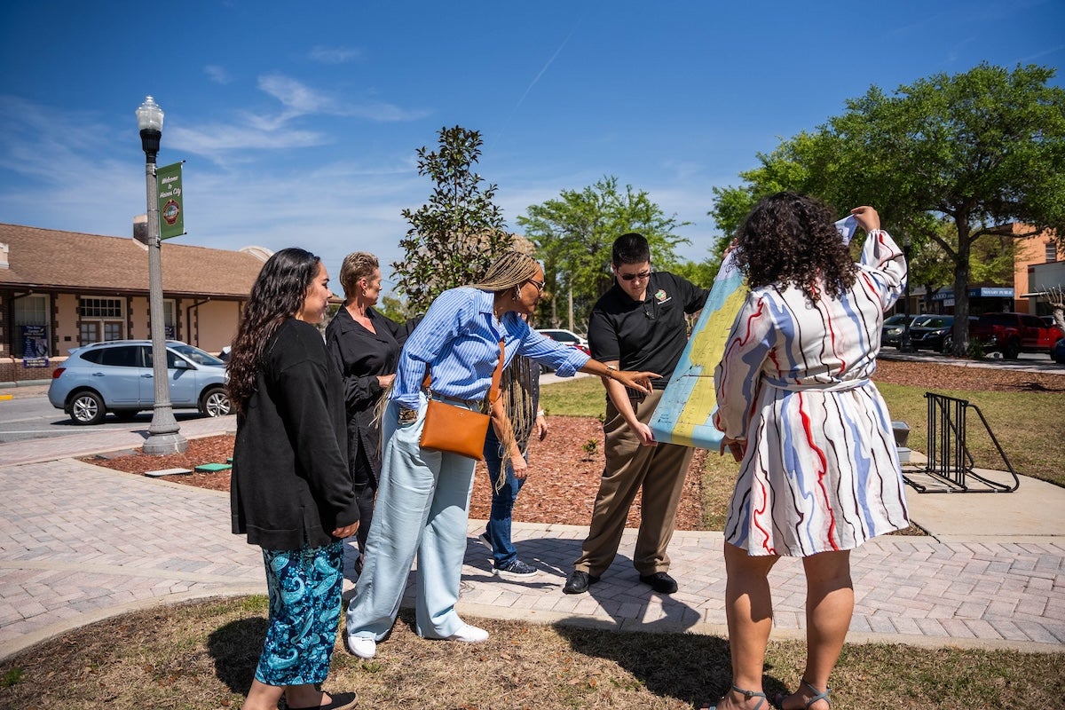 Students looking at a map outside