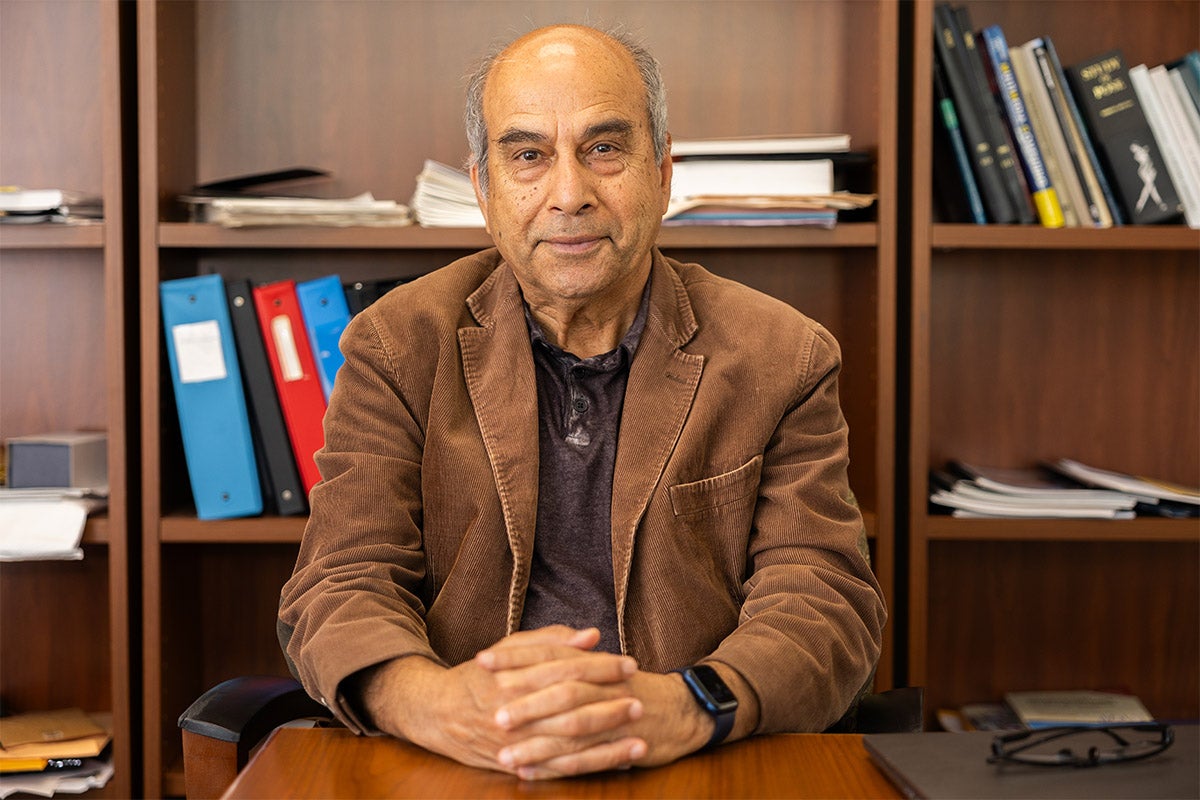 A photo of Mubarak Shah, UCF trustee chair professor of computer science and founding director of the Center for Research in Computer Vision, seated.