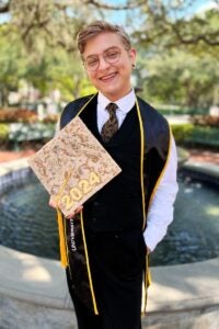 Student holding graduation cap