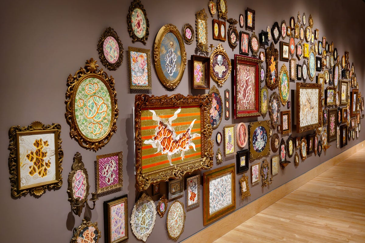 Framed pieces of colorful artwork on a wall