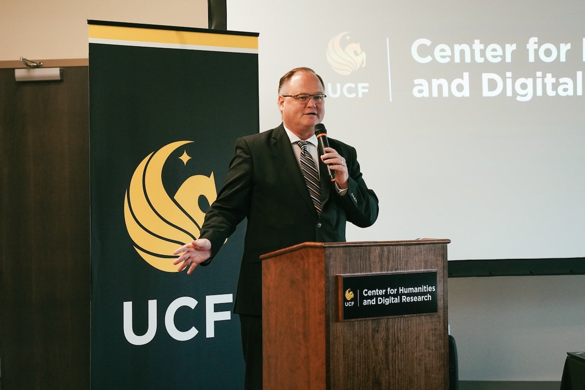A man speaking at a podium
