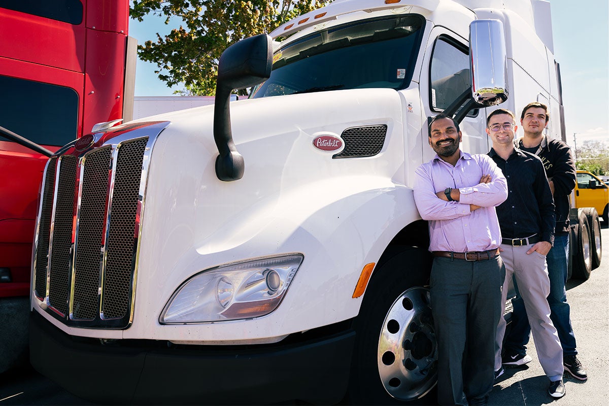 Mechanical and Aerospace Engineering Professor Subith Vasu and students pose with a PACCAR truck that may stand to benefit from Vasu's hydrogen combustion engine research.