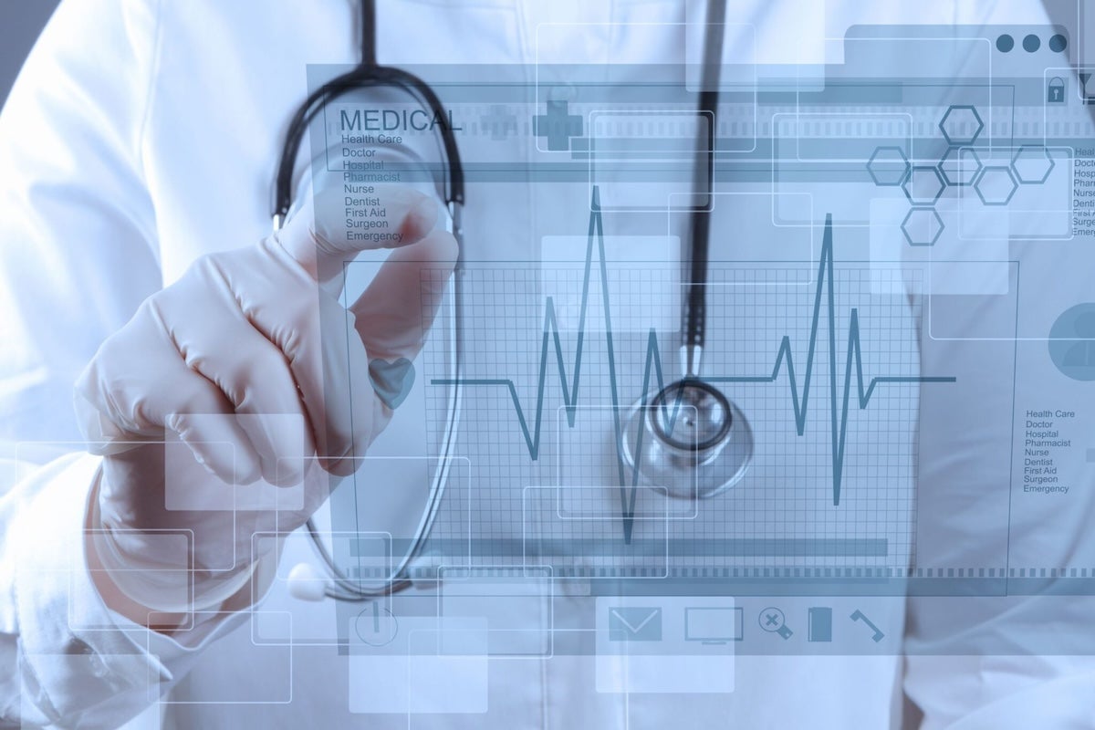 A collage of medical scans over an image of a doctor tapping a screen
