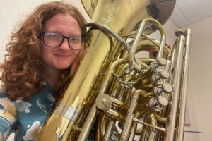 Faith Kidwell with a tuba