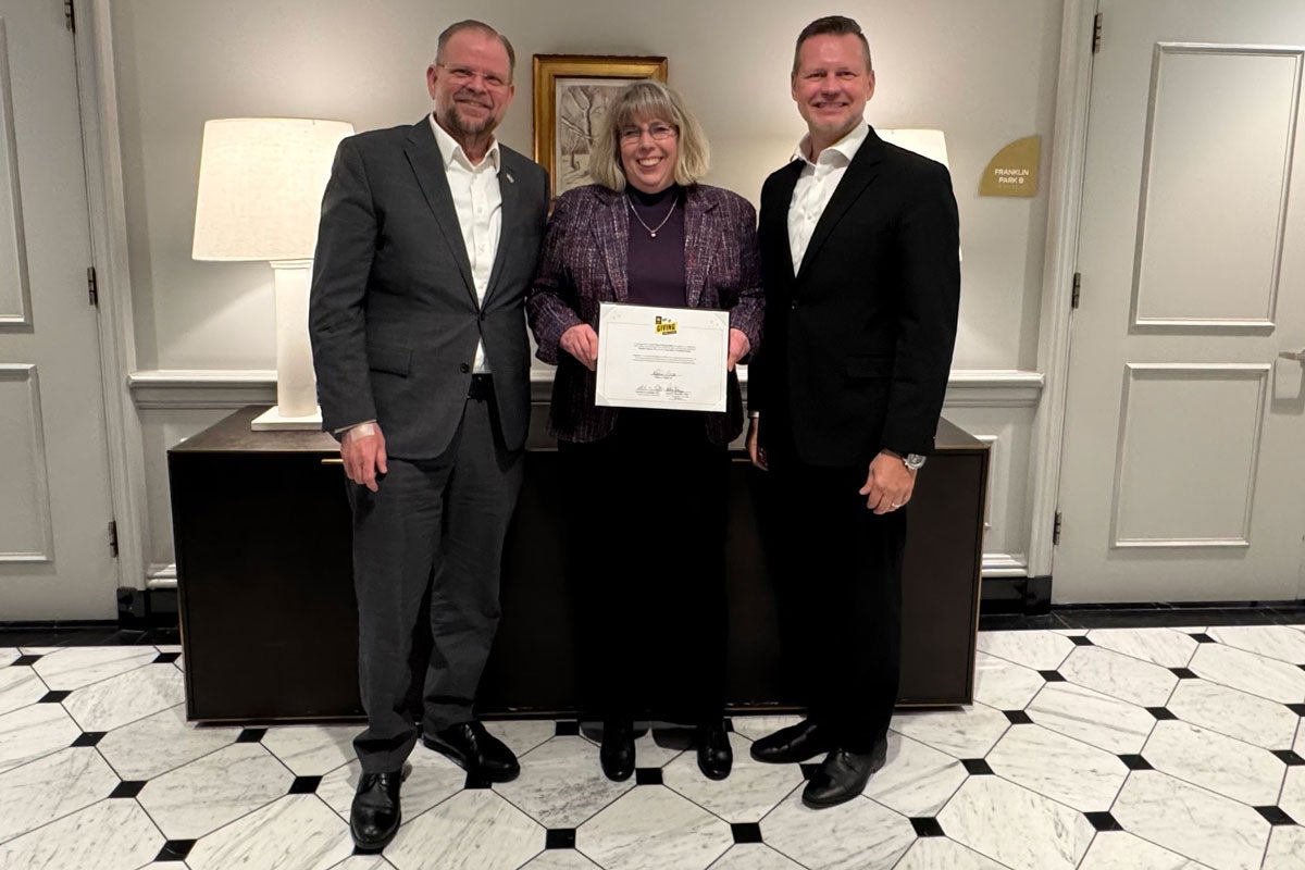 UCF President Alexander Cartwright, alum Heather Pigman and Rodney Grabowski, Senior Vice President for Advancement and Partnerships and CEO of the UCF Foundation