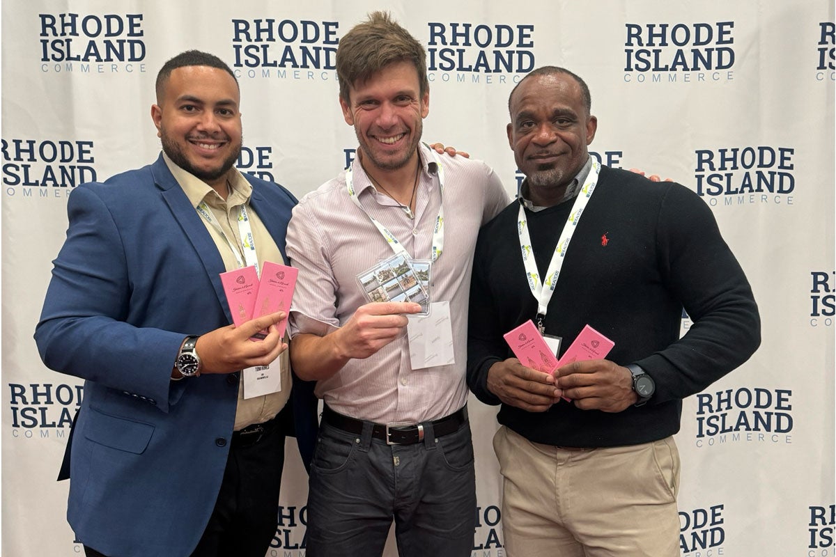 Three men posing for a photo