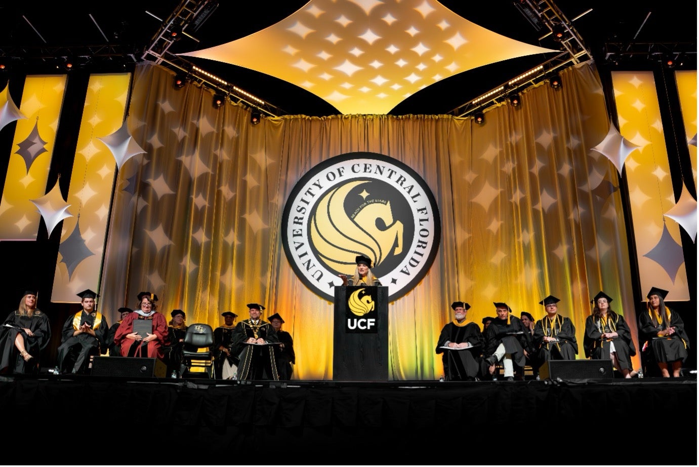 Yvette Kanouff speaking at a graduation