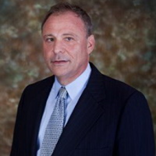 Person standing behind photo background