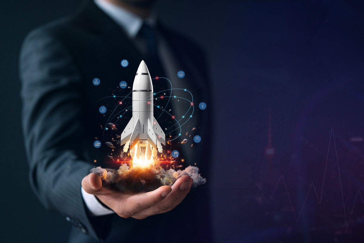 A rendering of a person in a suit wearing a rocket blasting off