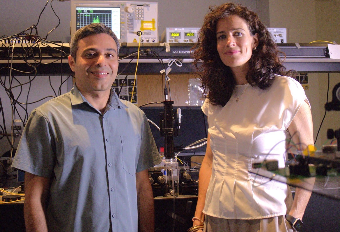 CREOL doctoral student Amin Hashemi Shahraki ’24MS (left) in the lab with Professor Andrea Blanco-Redondo (right).