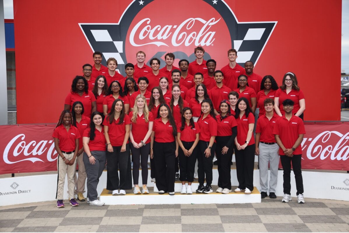 A group of students standing at a podium