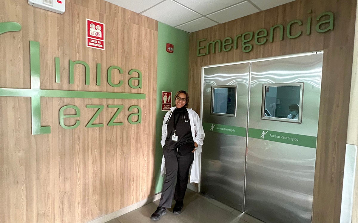 Photo of student standing in front of emergency room threshold.
