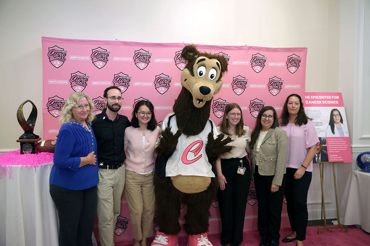 Annette Khaled, second from right, stands with UCF students and collaborators at the Orlando Sports Foundation’s Kickoff to Cure fundraising event.