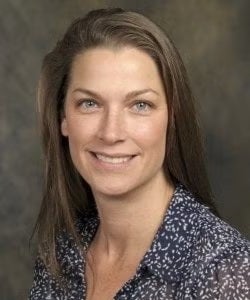 Headshot of UCF Biology Professor Barbara Sharanowski smiling in front of a grey backdrop.