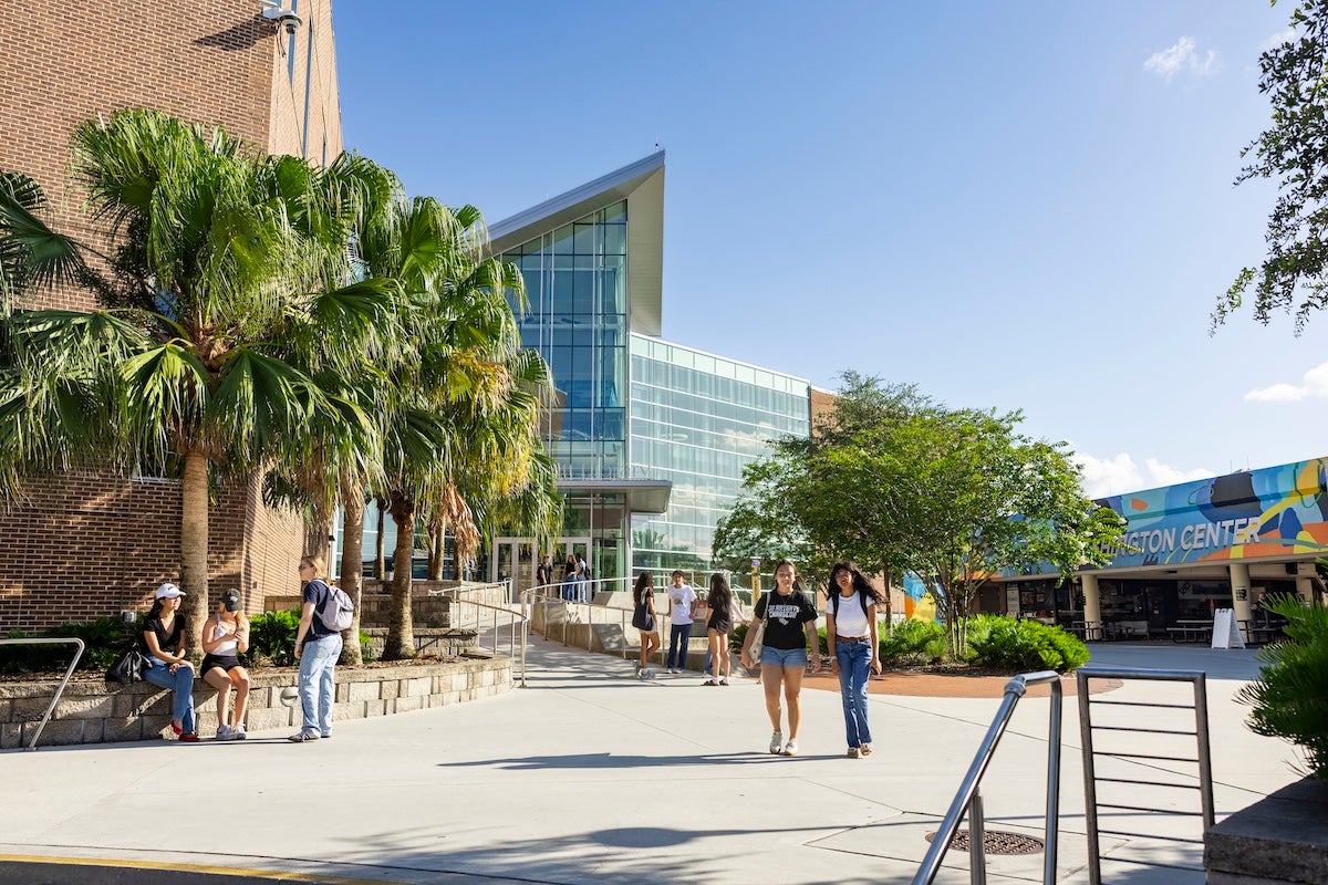 Students walk in front of John C. Hitt Library at UCF's main campus.